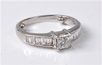 Lot 2192 - An 18ct diamond ring, the central princess cut...