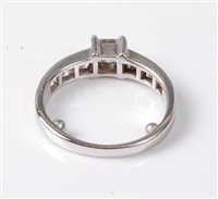Lot 2192 - An 18ct diamond ring, the central princess cut...