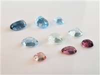 Lot 2681 - A quantity of mixed gemstones, to include blue...