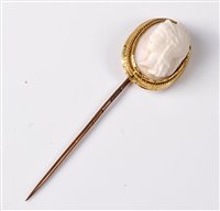 Lot 2315 - A cameo stick pin, the oval shell cameo of a...