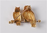 Lot 2197 - An 18ct owl brooch, the two naturalistically...