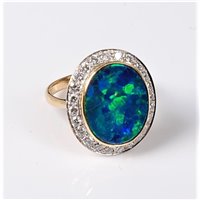 Lot 2232 - A black opal and diamond ring, the oval opal...