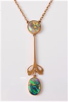 Lot 2221 - A 15ct opal necklace, the round collet mounted...