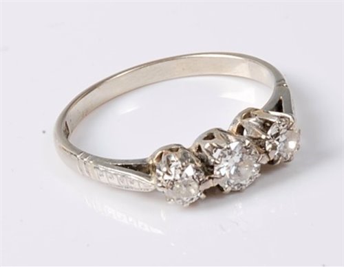 Lot 2519 - An 18ct three stone diamond ring, the three...