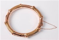 Lot 2280 - A 9ct faux bamboo bangle, the hinged faux...