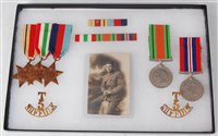 Lot 329 - A group of five WW II medals, to include...