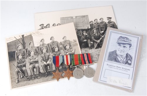 Lot 330 - A group of four WW II medals, to include...
