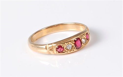 Lot 2627 - A ruby and diamond ring, the central oval ruby...