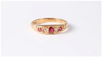 Lot 2627 - A ruby and diamond ring, the central oval ruby...