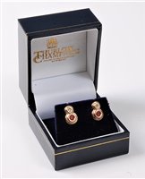 Lot 2262 - A pair of ruby and diamond earrings, the small...
