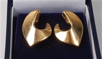 Lot 2185 - A pair of 18ct gold earrings, the polished...