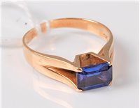 Lot 319 - A 14ct synthetic sapphire ring, the pale...