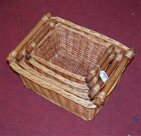 Lot 172 - A graduated set of three wicker baskets,...