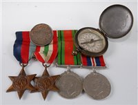 Lot 144 - A group of four WW II medals to include...