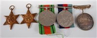 Lot 302 - A group of four WW II medals to include...