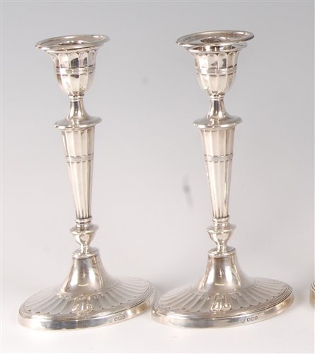 Lot 2142 - A pair of silver candlesticks, in the Adam...