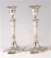Lot 2142 - A pair of silver candlesticks, in the Adam...