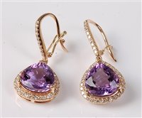 Lot 2268 - A pair of amethyst and diamond earrings, the...