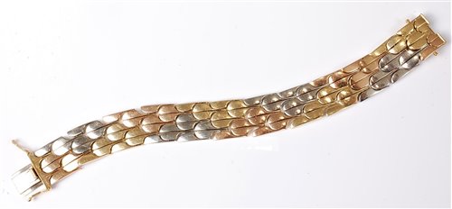 Lot 2189 - An 18ct tri-coloured gold bracelet, the...