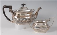 Lot 2130 - An Edwardian silver teapot, of half-reeded...