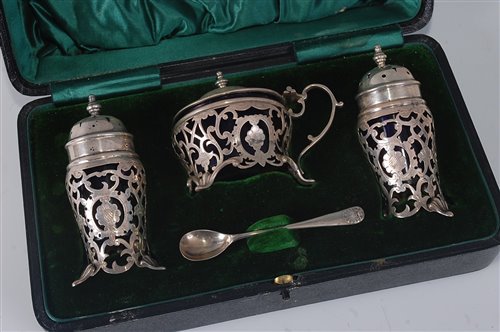 Lot 2146 - An Edwardian silver three-piece cruet set,...