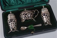 Lot 2146 - An Edwardian silver three-piece cruet set,...