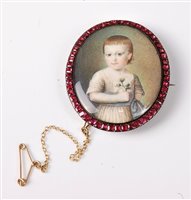 Lot 2266 - A garnet framed portrait miniature brooch, the...