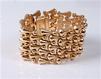 Lot 2203 - An Italian 18ct gold cuff bracelet and...
