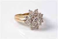 Lot 2234 - An 18ct diamond cluster ring, the central...