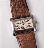 Lot 1224 - A lady's Cartier Tank Divan wristwatch, the...