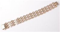 Lot 2202 - A 9ct gold cultured pearl bracelet, the three...