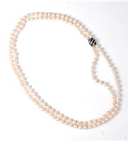Lot 1156 - A two strand cultured pearl necklace with...