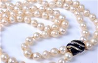 Lot 1156 - A two strand cultured pearl necklace with...