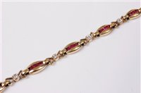 Lot 2274 - A ruby and diamond bracelet, the oval shaped...