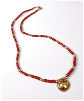 Lot 2281 - A coral and ruby necklace, the disc pendant,...