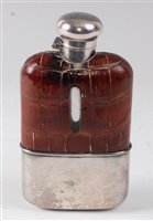 Lot 428 - A Victorian hip flask, having a leather clad...