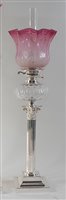 Lot 2418 - A silver plated oil lamp, having pink tinted...