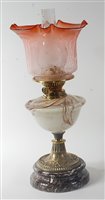 Lot 24 - A late Victorian brass pedestal oil lamp,...