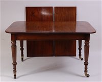 Lot 2687 - An antique mahogany extending dining table in...