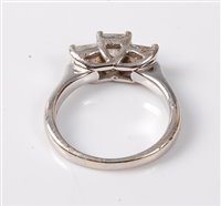 Lot 2217 - A '14k' three stone diamond ring, the three...