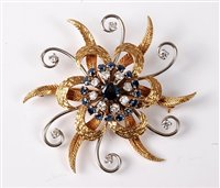 Lot 2253 - A sapphire and diamond brooch, the central...