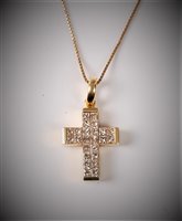 Lot 2223 - An 18ct diamond cross necklace, the cross...