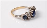 Lot 2248 - An 18ct sapphire and diamond ring, the three...
