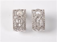Lot 2302 - A pair of 18ct diamond filigree earrings, the...