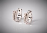 Lot 2301 - A pair of 18ct diamond earrings, the 5mm wide...