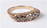 Lot 2311 - A five stone diamond ring, the five graduated...