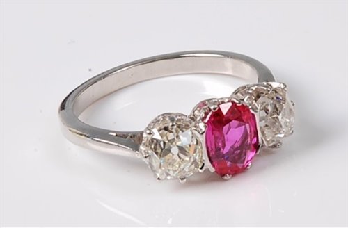 Lot 2287 - A pink sapphire and diamond ring, the oval...