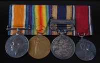 Lot 178 - A group of four medals to include WW I British...