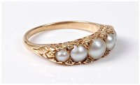 Lot 2304 - A five stone cultured pearl ring, the five...