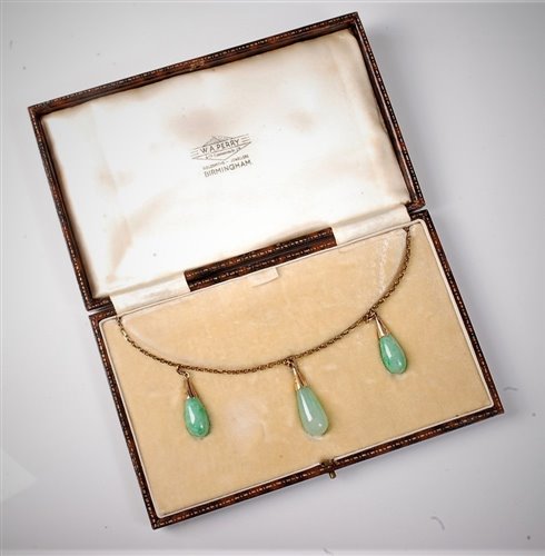 Lot 2211 - An Edwardian jade necklace, the three...